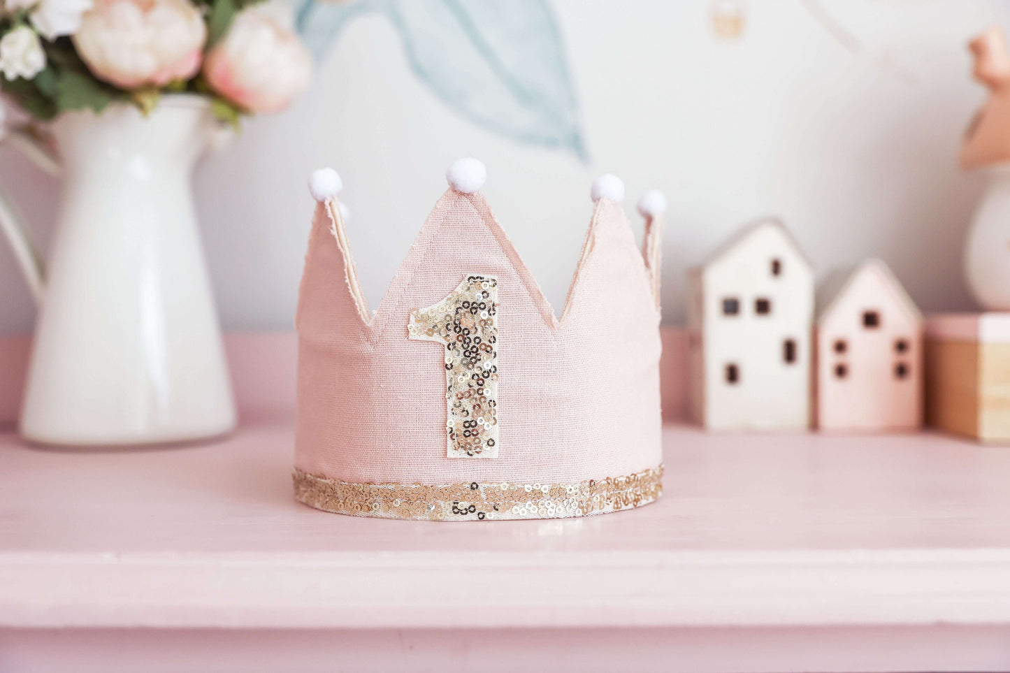 1st Birthday Crown in pink linen with gold sequins and pom-poms, perfect for celebrating your little one's milestone.