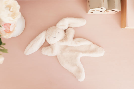 Darcey Bunny Comforter 30cm in ivory, super soft plush with embroidered face, perfect for snuggling babies from birth.