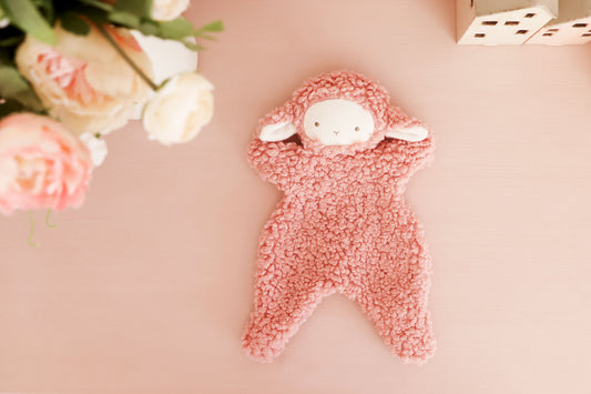 Leni Lamby Comforter 30cm in soft pink, featuring an embroidered face and fluffy ivory sherpa body, perfect for babies.