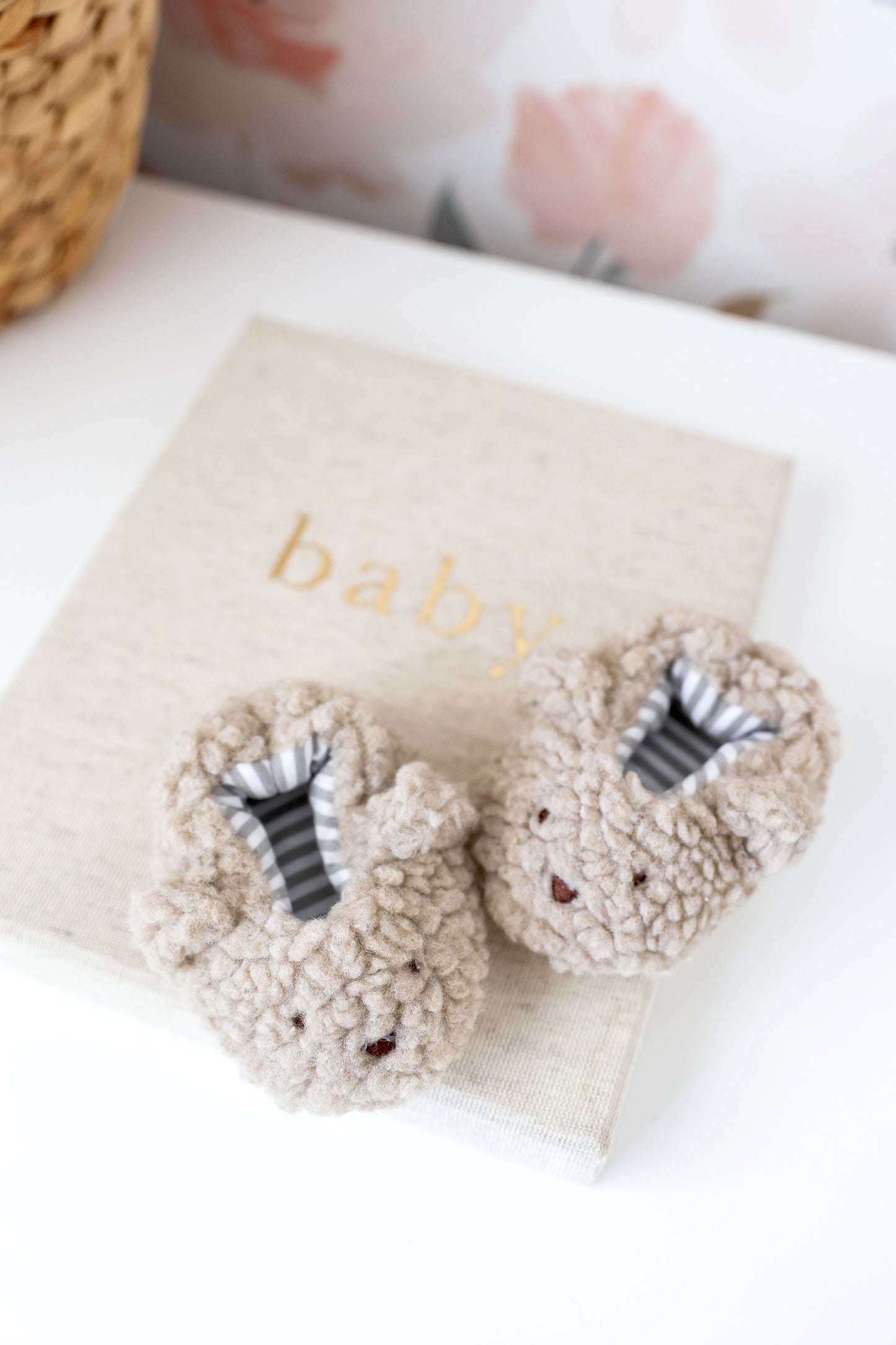 Soft sherpa bear booties in oatmeal for babies, featuring bear faces and soft grip soles, perfect for 0-6 months.