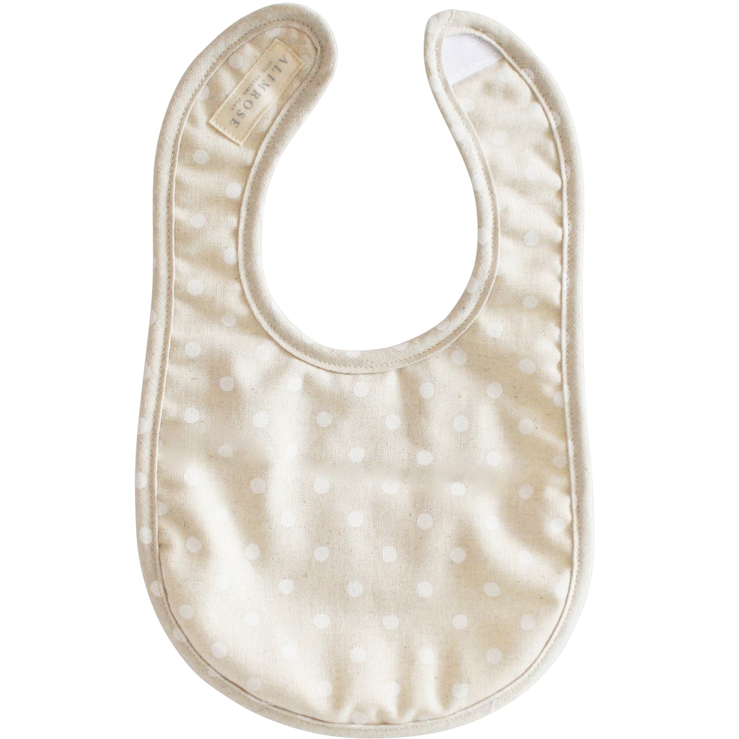 Alimrose white linen spot bib, featuring natural cotton fabric and Velcro fastening, perfect for mealtime.