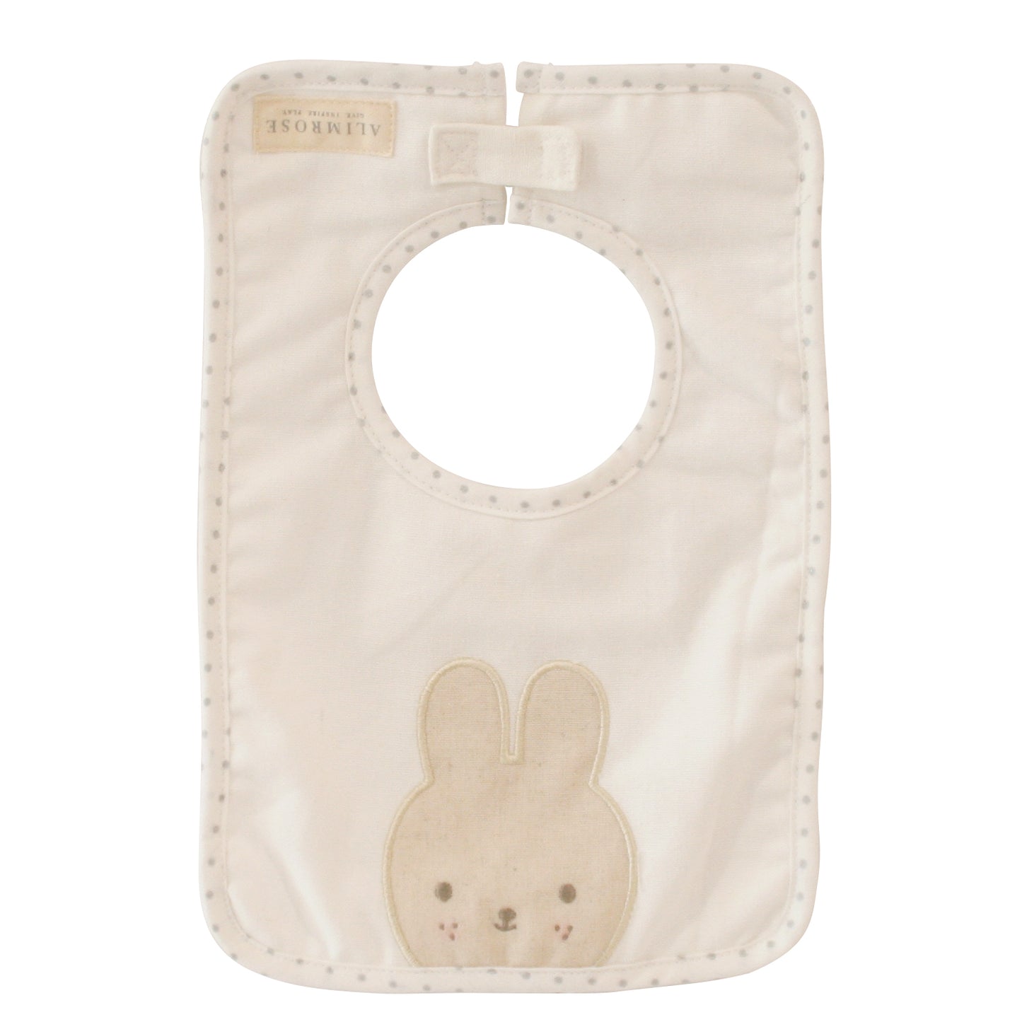 Ivory linen bunny bib with cute bunny appliqué and embroidered face, perfect for mealtime with little ones.