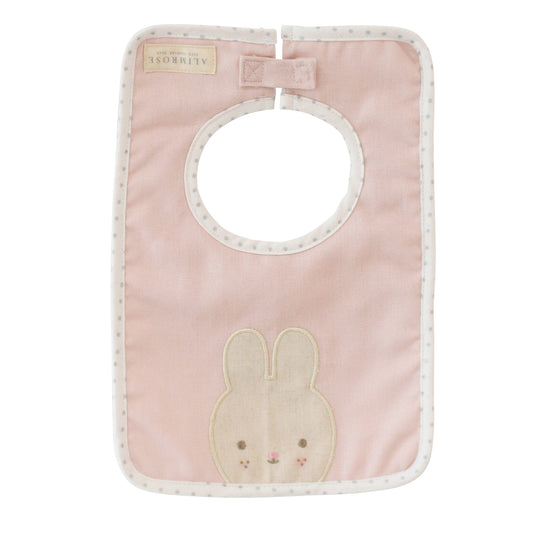 Pink linen bunny bib by Alimrose, featuring cute bunny appliqué and Velcro closure for kids' mealtime.