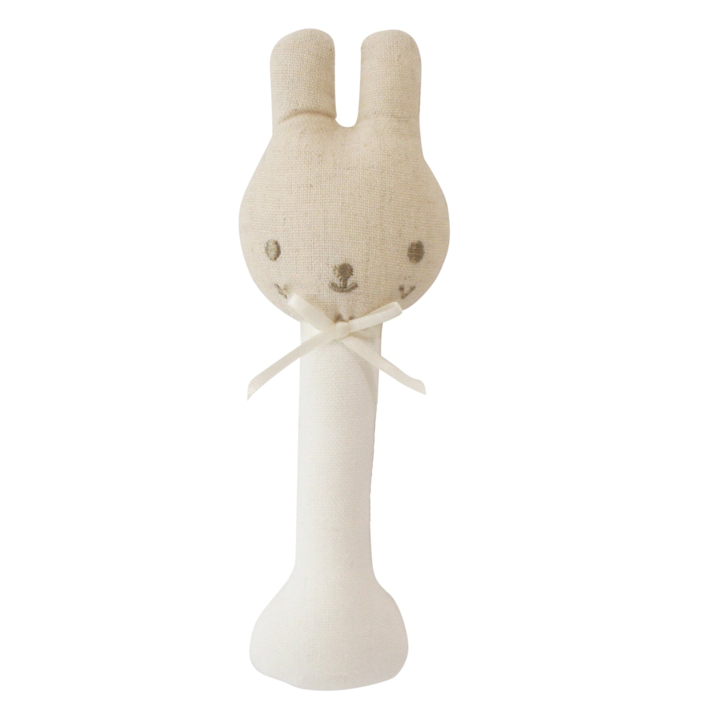 Beige fabric baby rattle with a bunny head, embroidered face, and soft white handle tied with a ribbon.