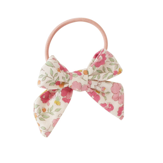 Alimrose Bow Hair Tie in Rose Garden fabric, featuring pink floral design on a soft hair elastic.