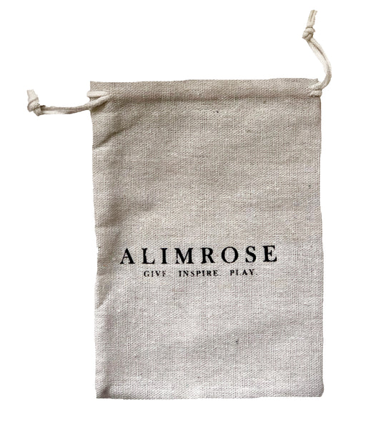 Natural linen drawstring pouch with Alimrose logo and slogan in black text.