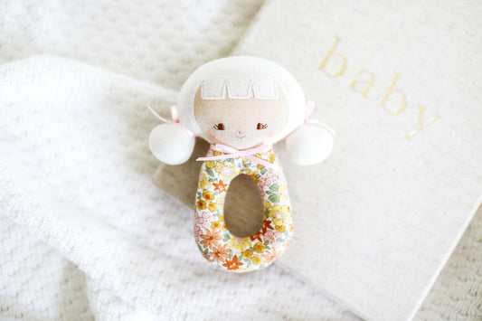 Audrey Grab Rattle 15cm in Sweet Marigold, perfect newborn gift with circular handle and gentle rattling sound.