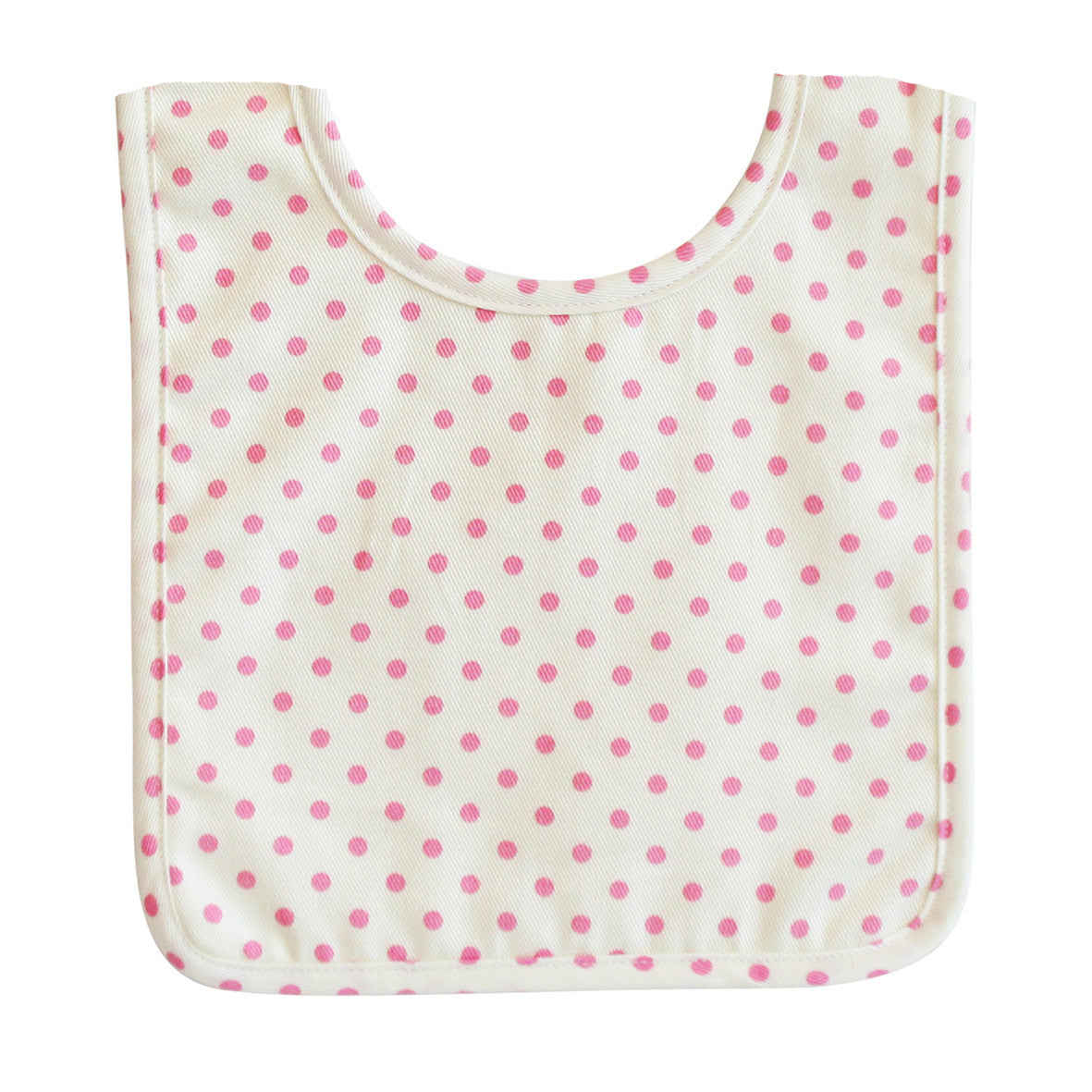 Baby bib in ivory cotton with pink polka dots, absorbent backing, and Velcro closure, perfect for mealtime.