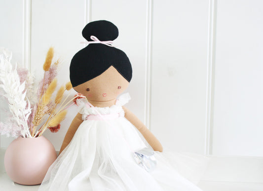 Alimrose Charlotte Doll 48cm in ivory tulle dress, perfect for imaginative play, alongside stylish decor.