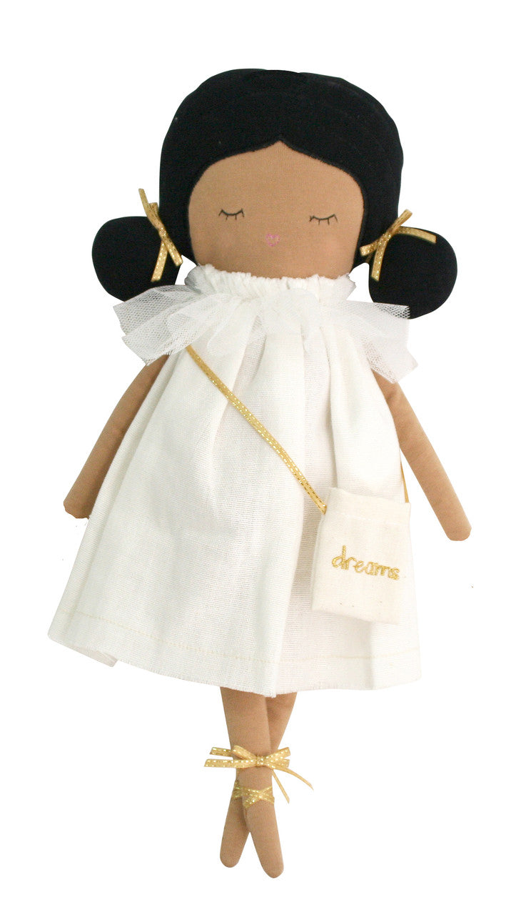 Emily Dreams Doll 40cm in ivory linen dress, embroidered face, and cute side buns hairstyle with ribbons.