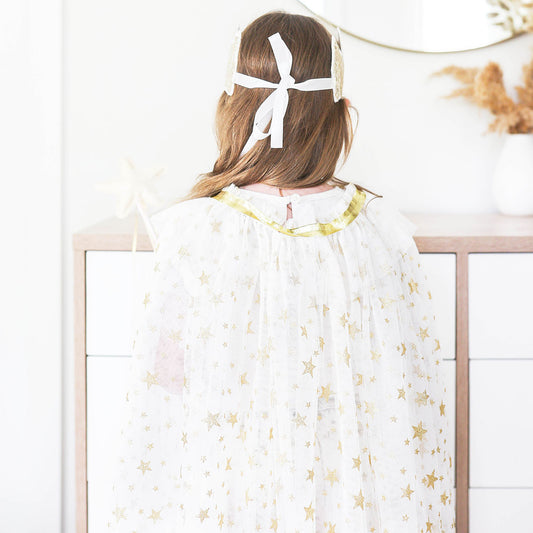Whimsical ivory tulle star cape for kids with gold stars, perfect for dress-up play ages 3-10.