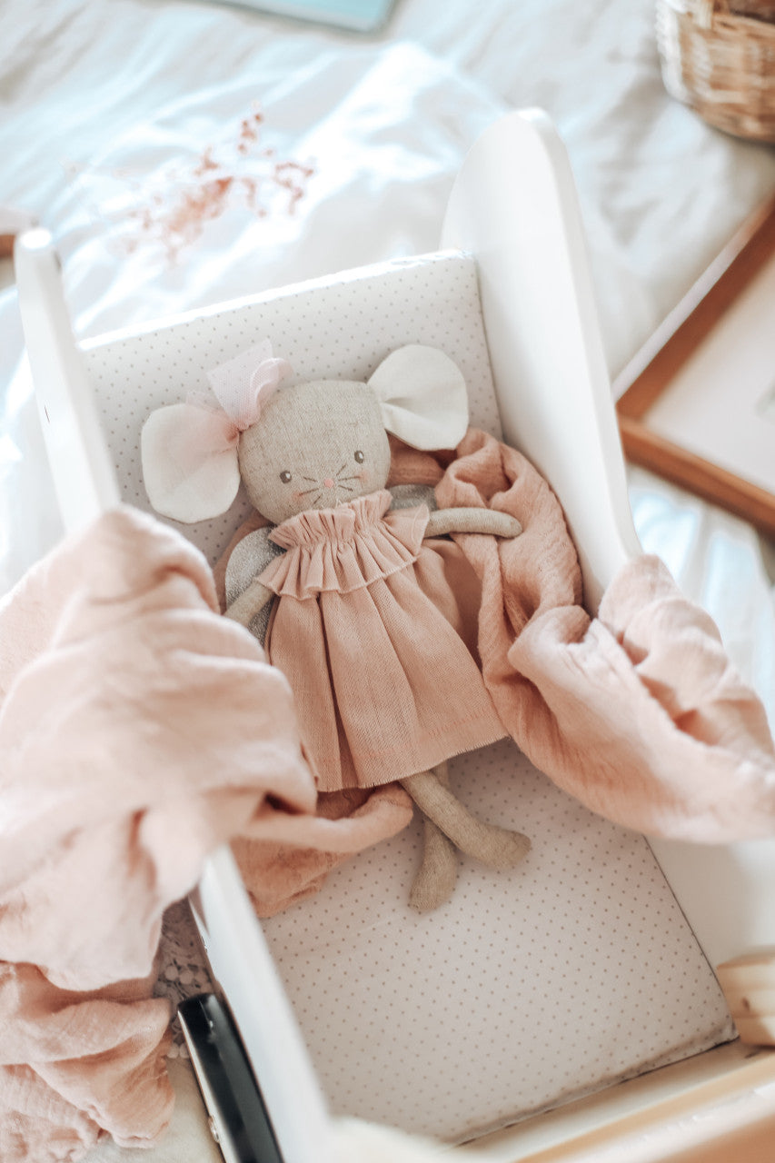 Cute 25cm pink angel baby mouse doll in a cozy cradle, featuring sparkly wings and ruffled dress. Perfect for kids 3+. Adorable!