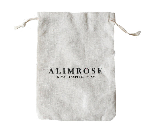 Cotton gift bag from Alimrose with 'Give Inspire Play' slogan, perfect for gifting baby products.