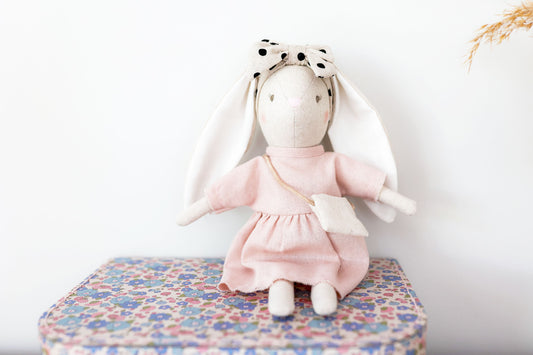 Alimrose Mini Sofia Bunny, 27cm pink doll with a polka dot headband and cross-body bag, perfect for kids.