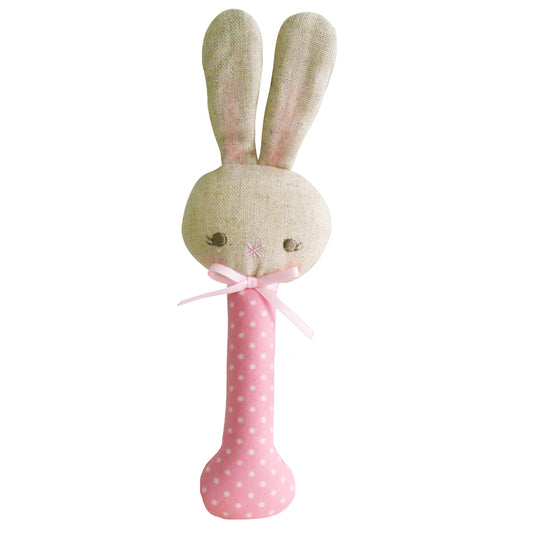 Cute pink Baby Bunny Stick Rattle with white spots, perfect for tiny hands and safe for mouthing, ideal from 3 months.