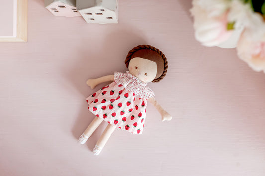 Cute Baby Coco Doll 26cm in strawberry print dress, suitable for kids 3 years and up, with embroidered face and plaited hair.