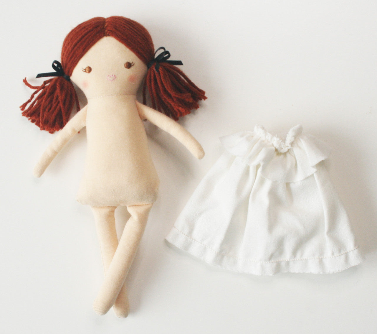 Mini Matilda doll in ivory, with removable dress, promoting imaginative play for children.