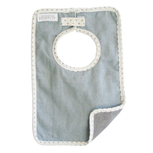 Stylish Bobby Bib in grey linen with absorbent backing for kids' mealtime, showcasing elegance and practicality.