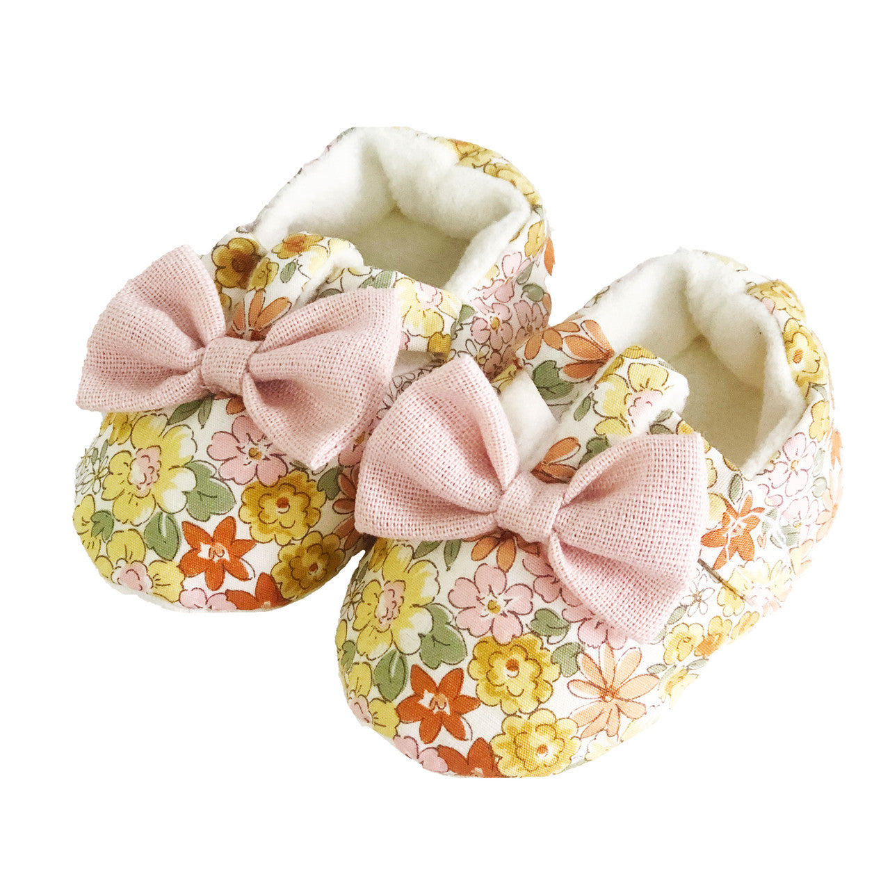 Cute Bow Booties in Sweet Marigold floral pattern for newborns, featuring soft grip sole and machine washable design.