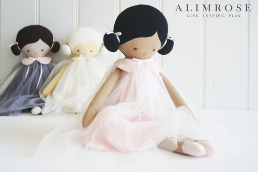 Lulu Doll 48cm in pink, beautifully designed with soft linen dress and charming face, perfect for imaginative play.