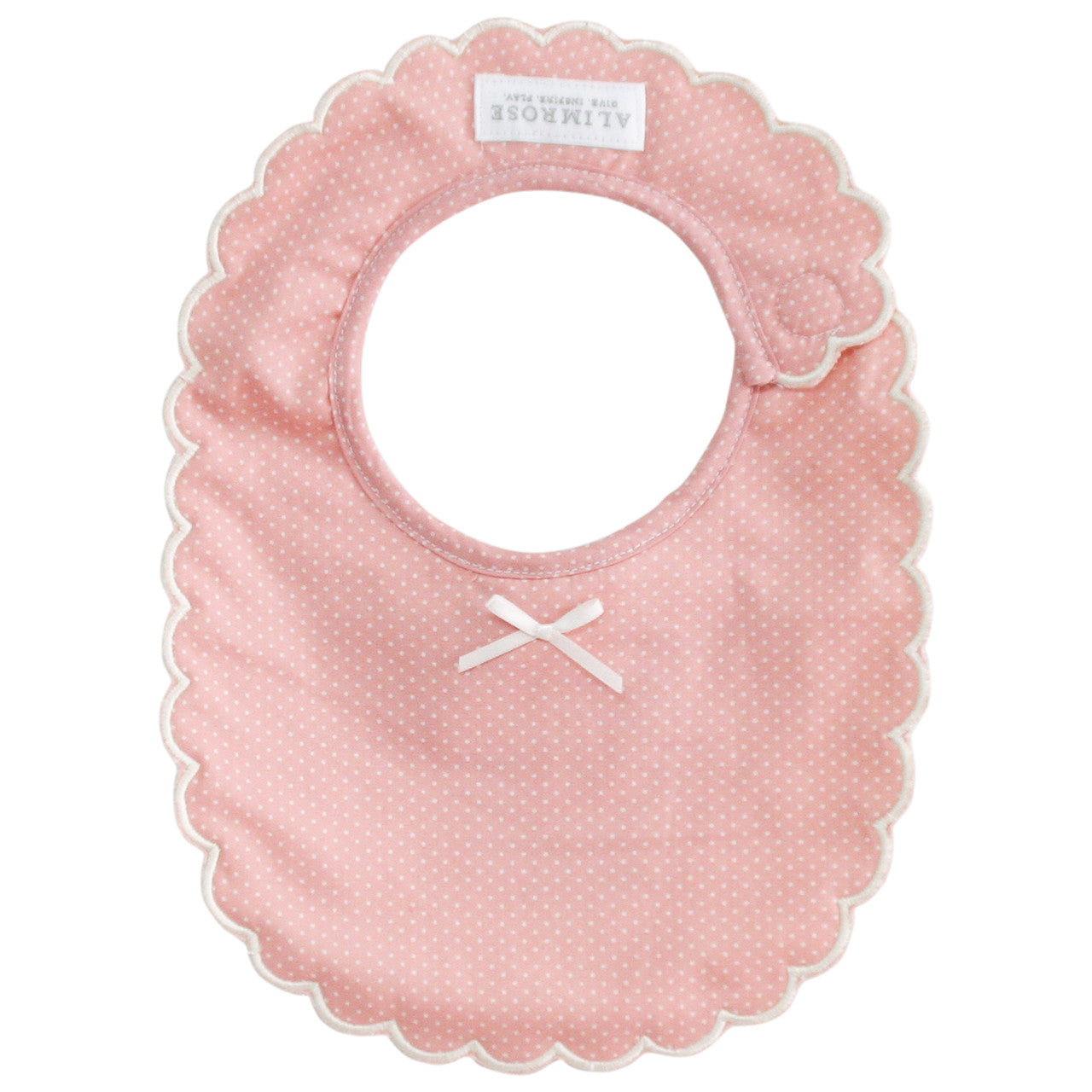 Alimrose Scallop Bib in pink with ivory spots, featuring embroidered edges and Velcro closure, perfect for little ones.