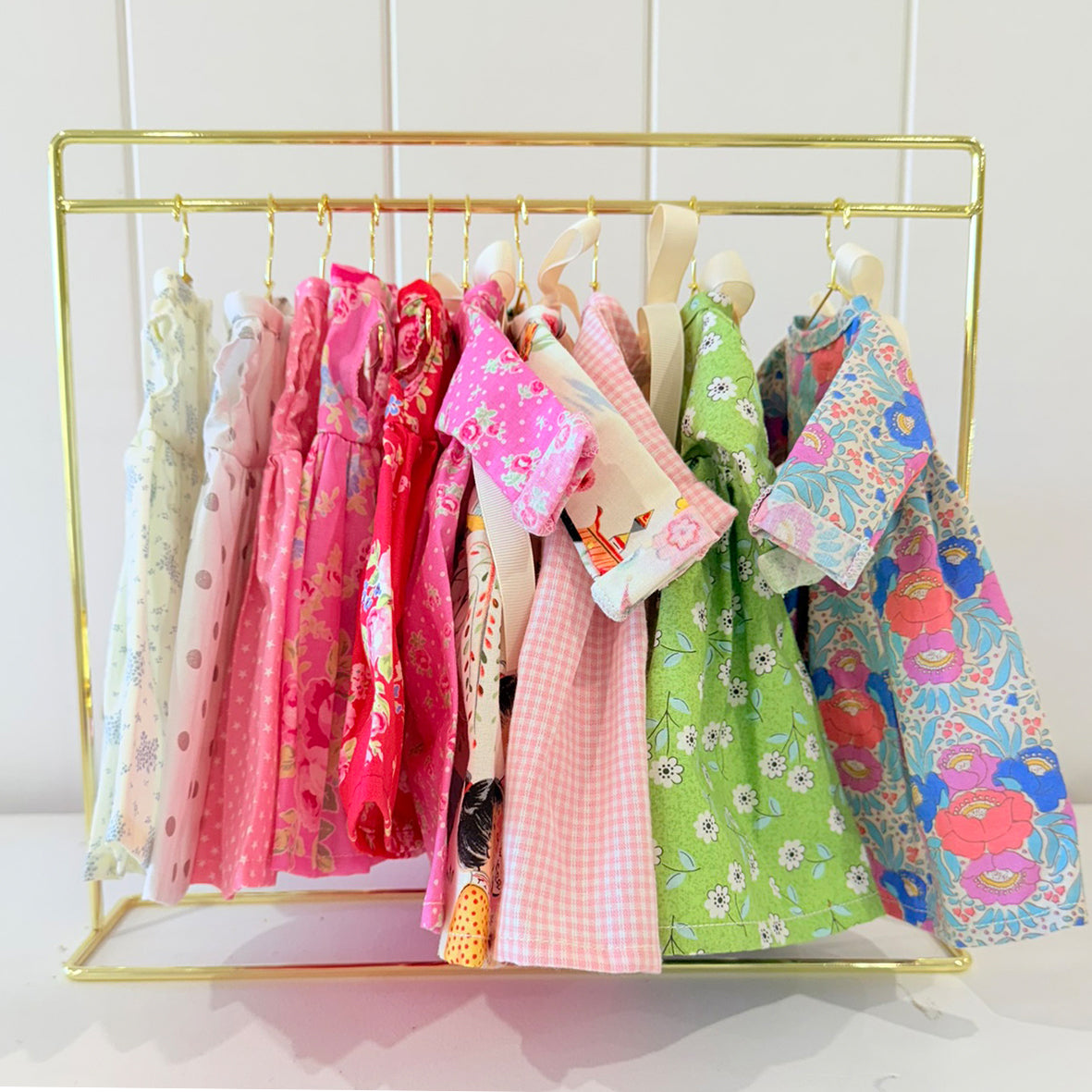 a rack of clothes on swingers