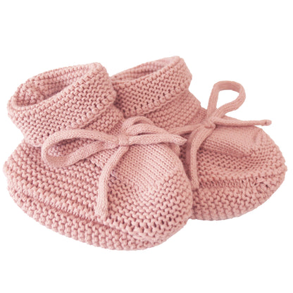 Pink knitted baby booties with folded cuffs and tied bows, suitable for 0-6 months.