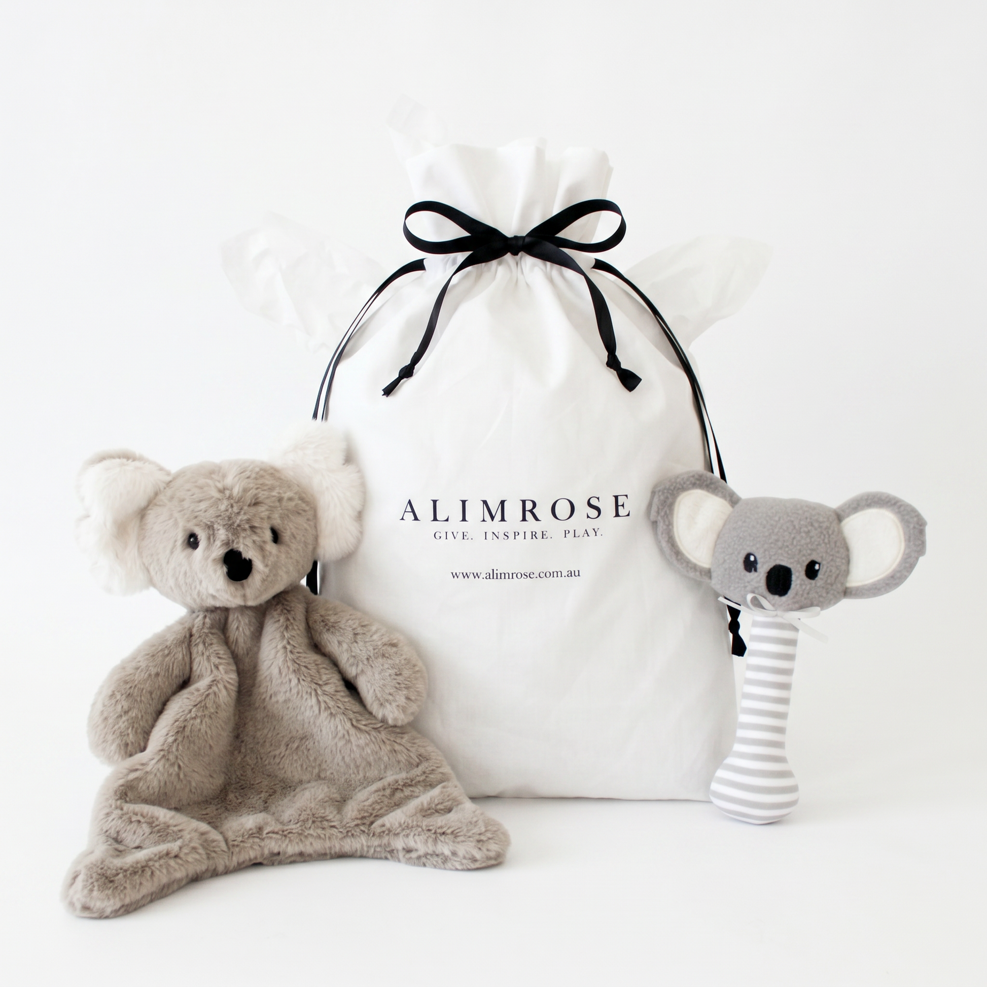 Soft gray koala plush comforter and matching rattling koala toy with striped body, paired with white drawstring gift bag.