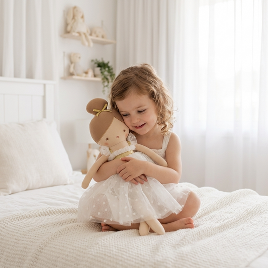 53cm soft fabric doll with brown hair buns, wearing a white dress with star patterns.