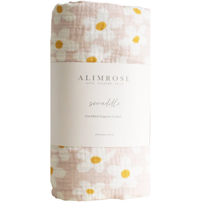 Alimrose large daisy muslin swaddle in soft pink, made from certified organic cotton, perfect for newborns.