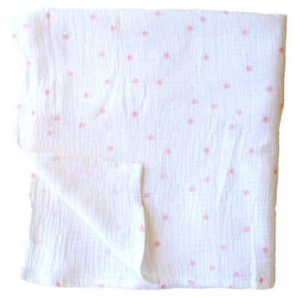 White muslin swaddle with soft pink star pattern, lightweight and breathable fabric.