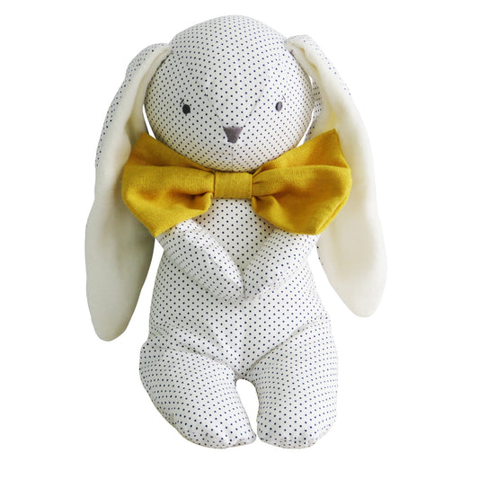 Soft white plush bunny with navy polka dots and large mustard-yellow bowtie.