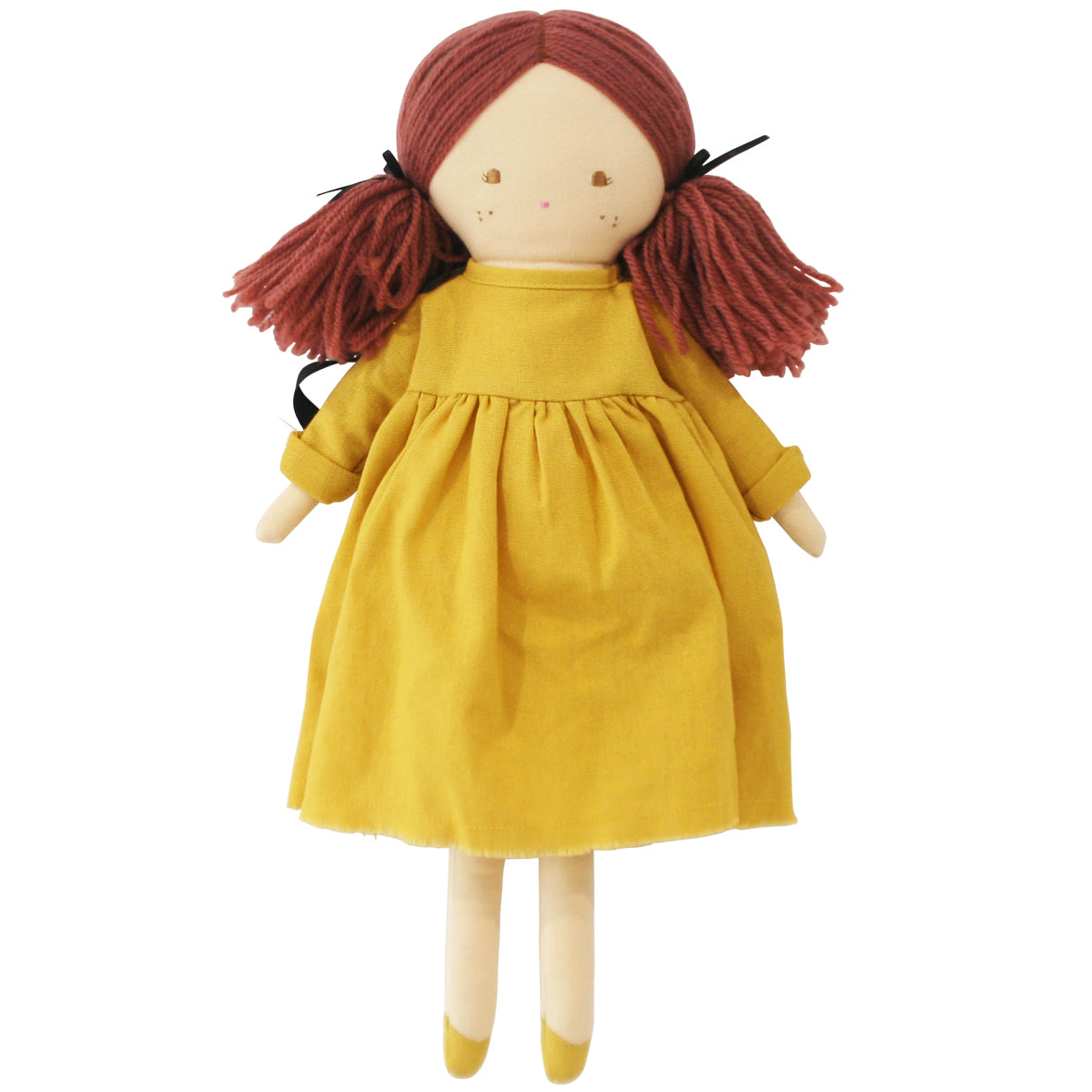 Handmade cloth doll with red yarn hair in pigtails, simple stitched face, wearing mustard yellow dress.