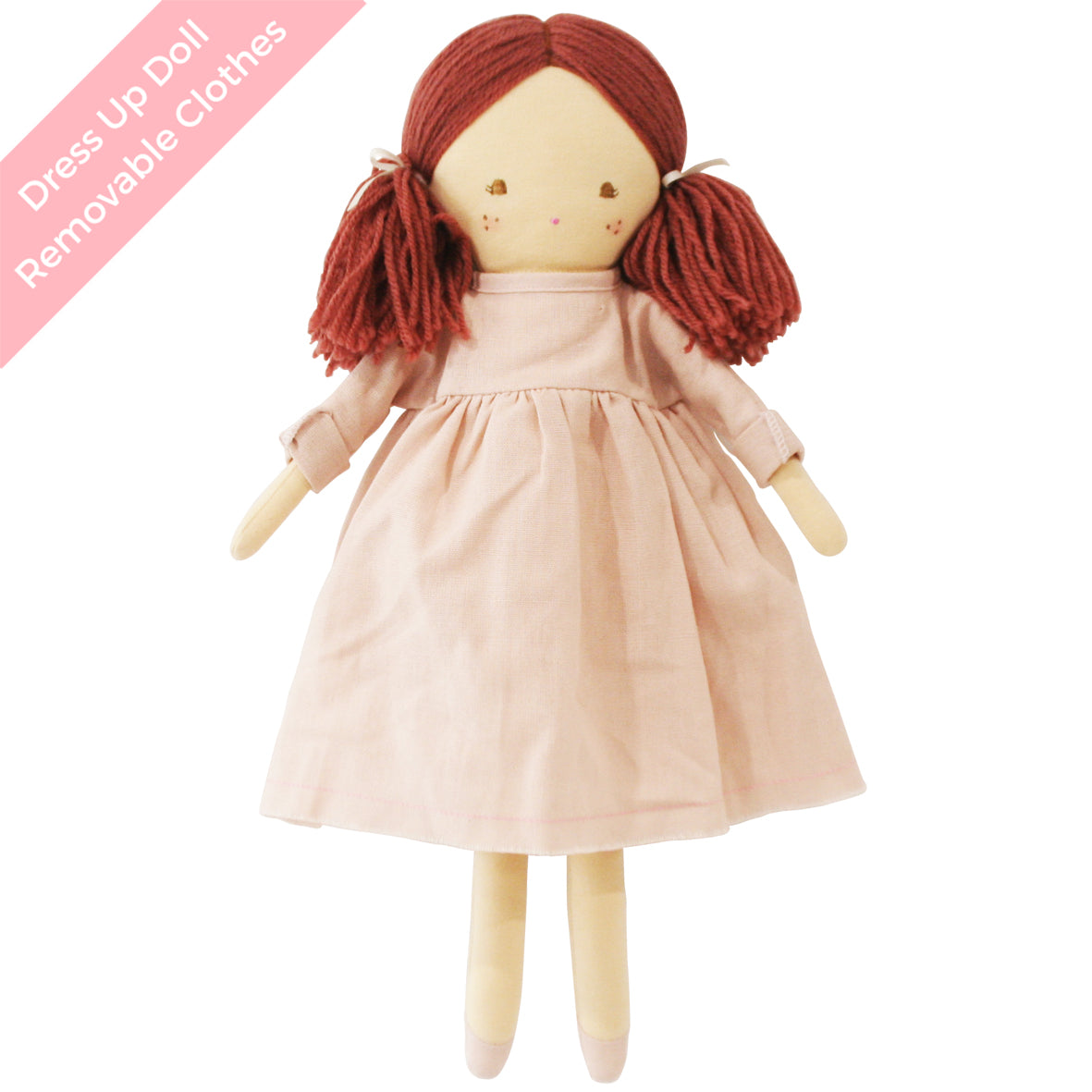 Soft fabric doll with red yarn hair in pigtails wearing a pale pink dress.