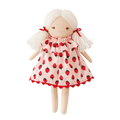 Cloth doll with white yarn hair tied in pigtails wearing pink strawberry-patterned dress with red trim.