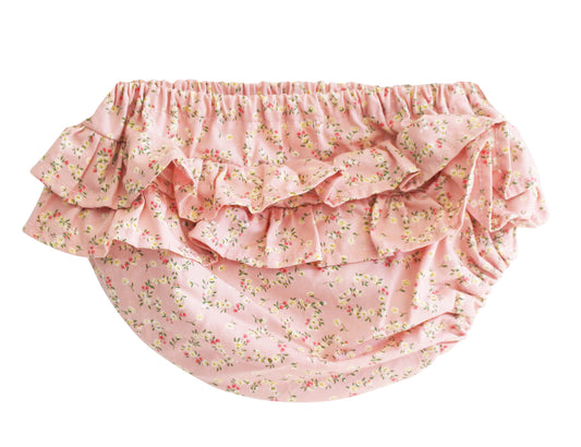 Pink cotton baby bloomers with layered ruffles and a small floral posy heart print.