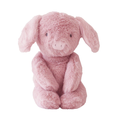Soft pink plush pig toy sitting upright with floppy ears and embroidered facial details.