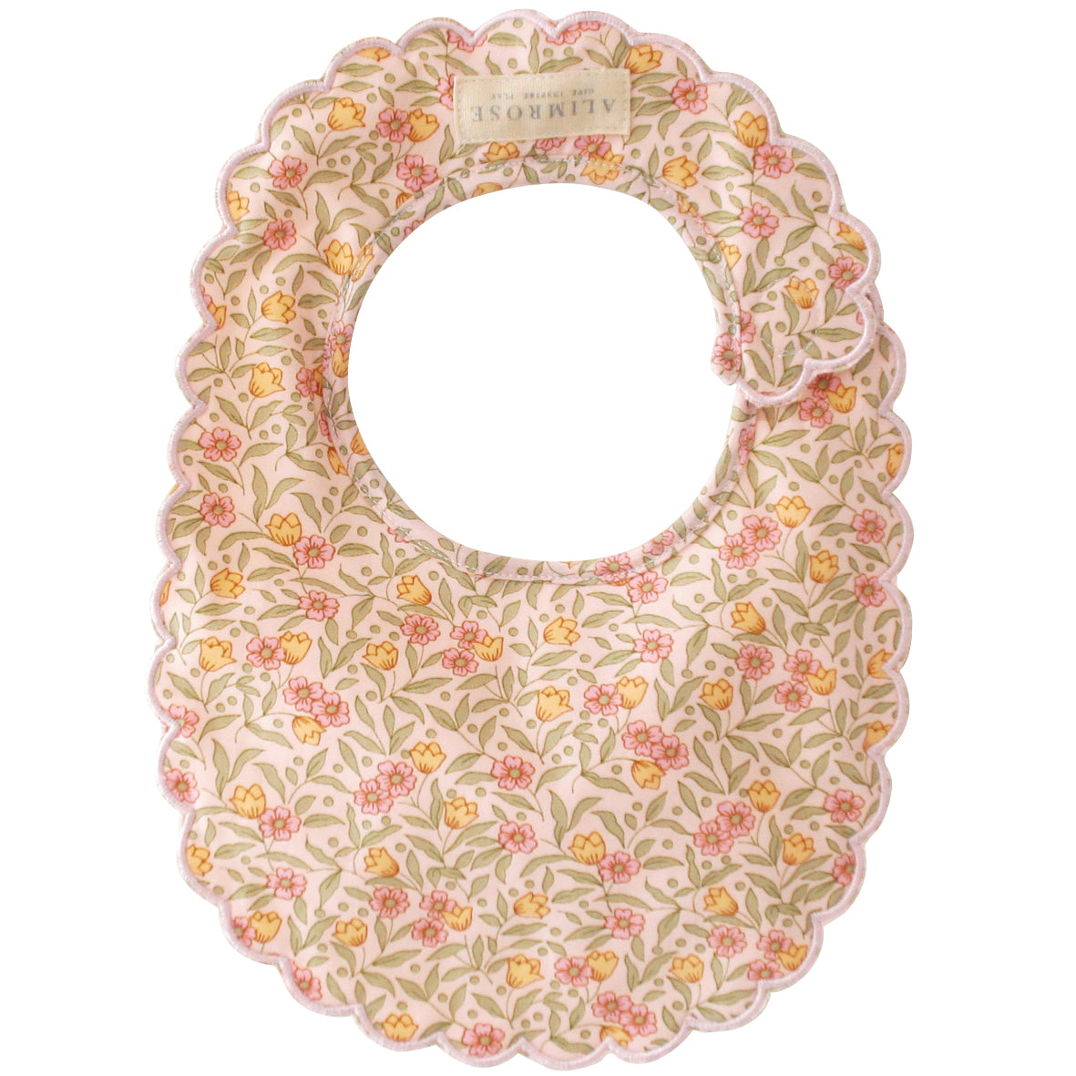 Scalloped-edge baby bib with pink floral and leaf print on cream background.