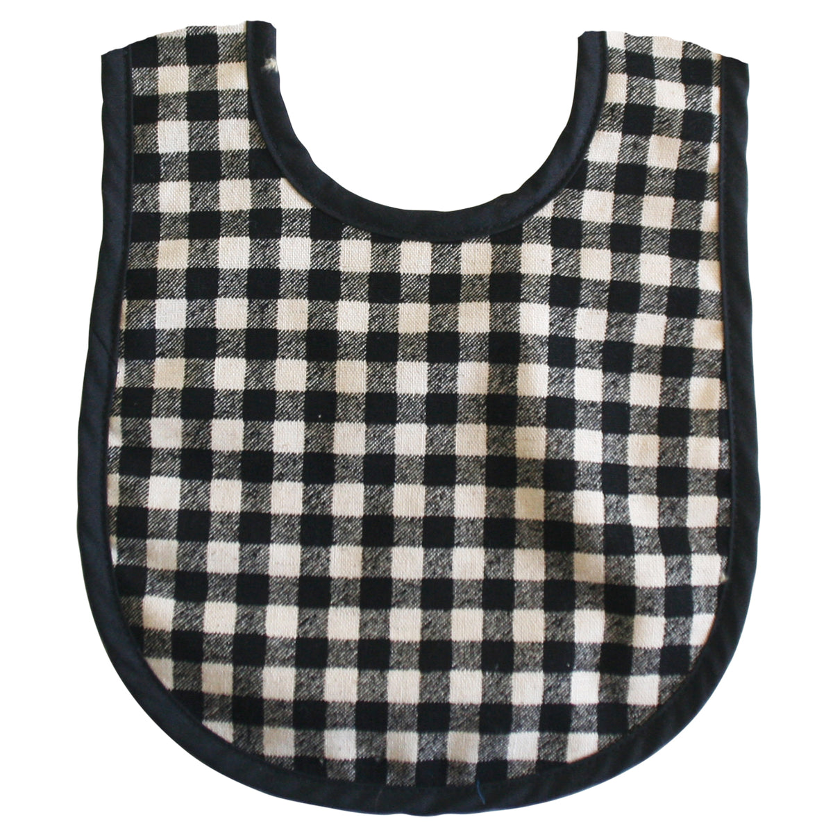 Black and white checkered linen bib with rounded neckline and black trim.