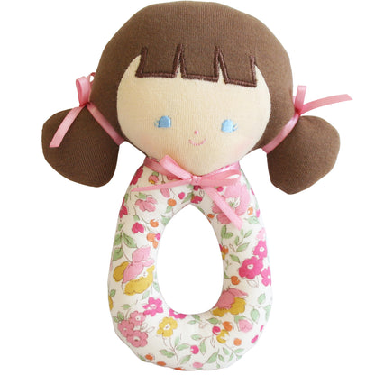 Soft fabric baby rattle with a brown-haired doll head, pink ribbons, and floral patterned handle.