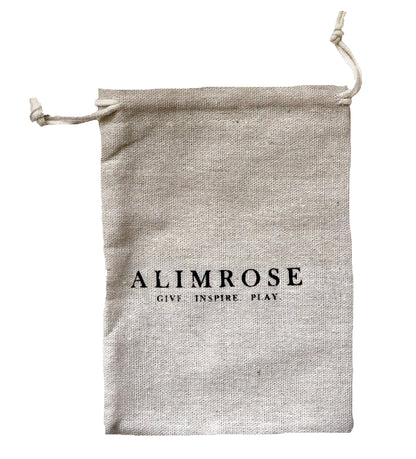 Natural linen drawstring pouch with Alimrose logo and tagline in black text.