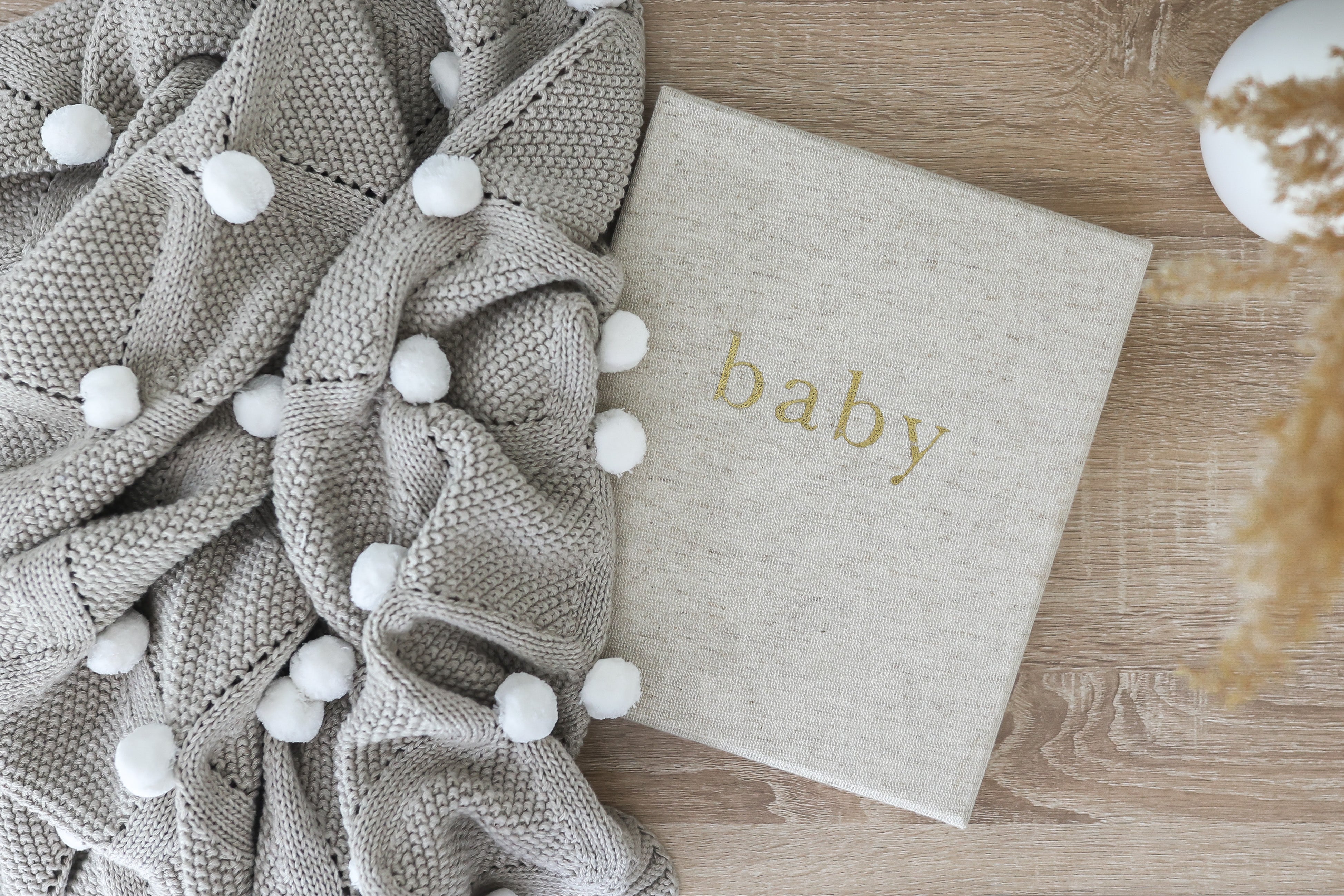 Baby blanket sales with pom poms