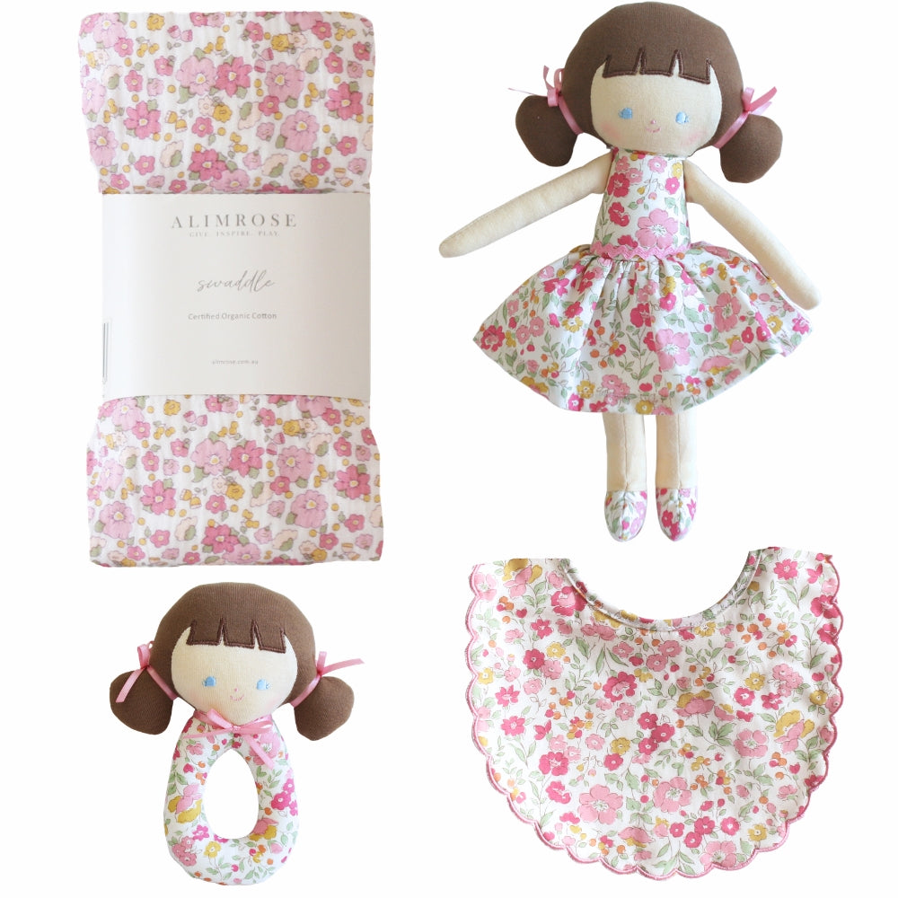 Gift set including floral swaddle, floral small doll, floral doll rattle, floral bib. all in pink rose colour floral.